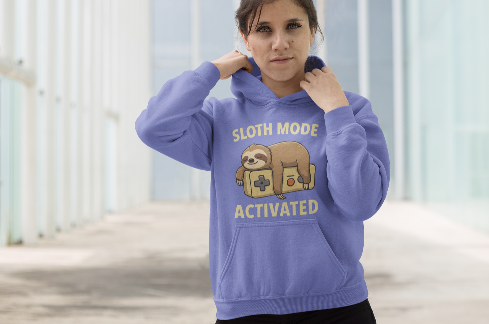 Person wearing a purple hoodie with 'Sloth Mode Activated' text and graphic.