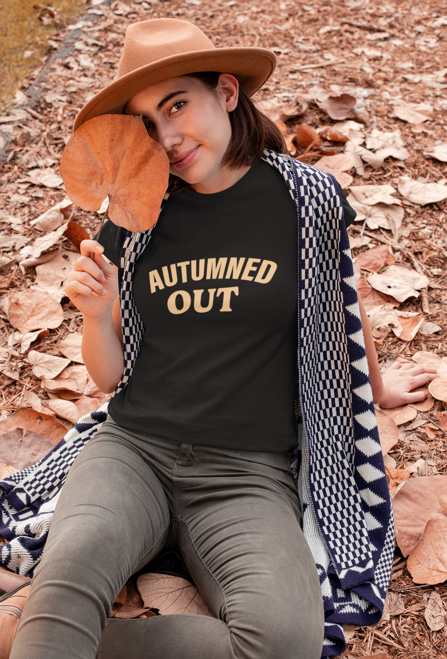 Women's t-shirt in black with 'Autumned Out' text, fall inspired graphic tee.
