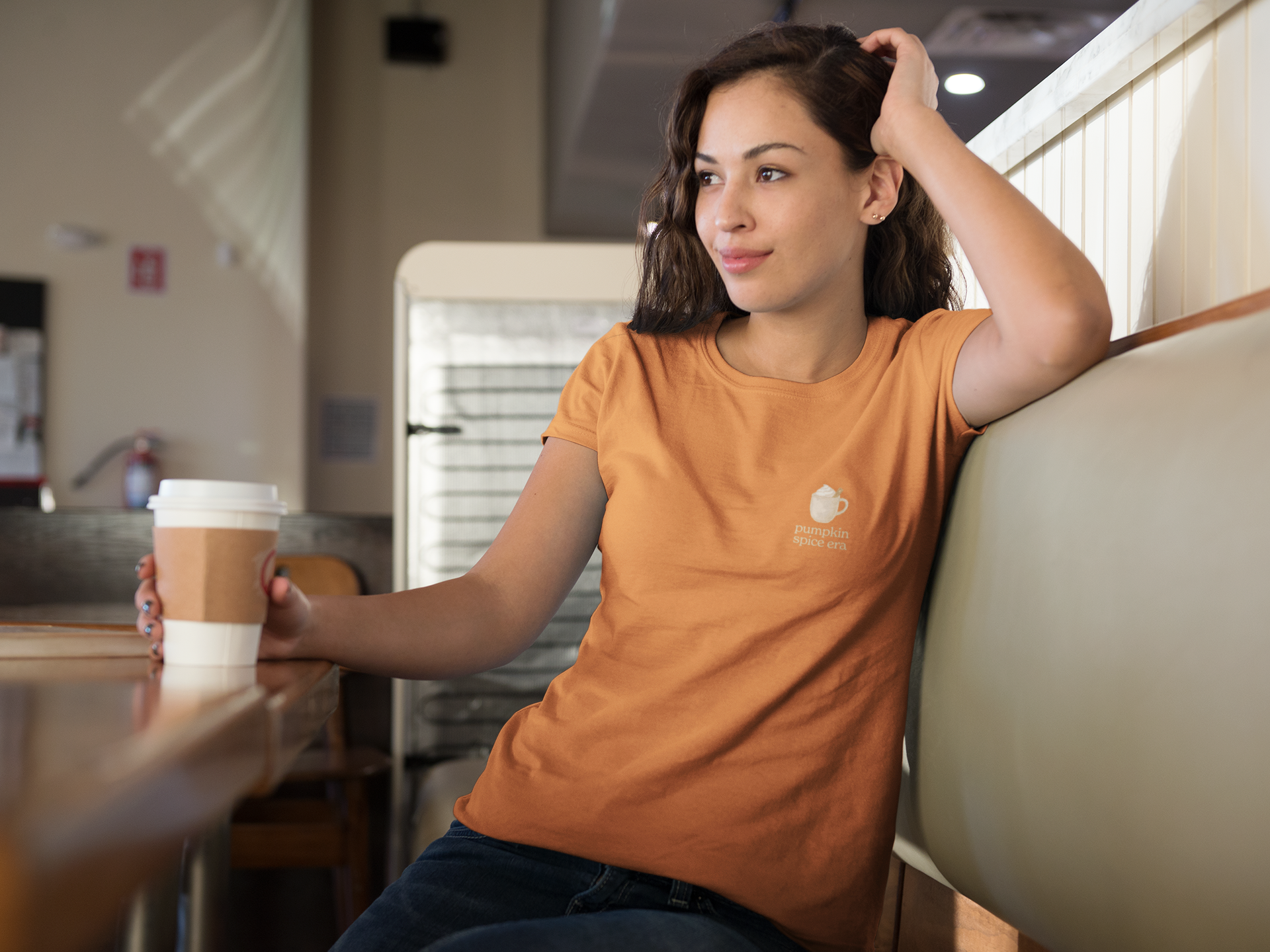 Women's t-shirt in orange with minimal pocket sized 'Pumpkin Spice Era' graphic & text of a pumpkin spice latte. Fall seasonal wear, pumpkin and cinnamon.