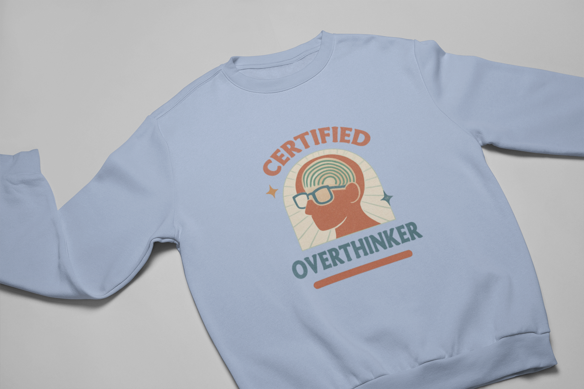Light blue unisex crewneck sweatshirt with retro Certified Overthinker graphic, featuring silhouette head with spiral brain and glasses.