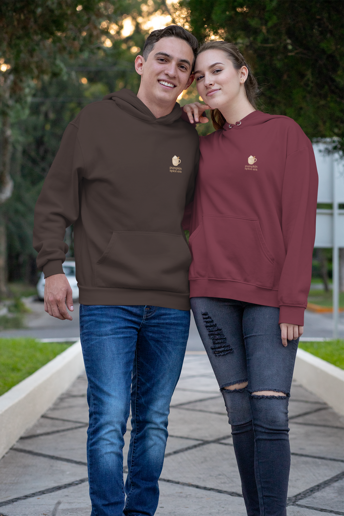 Matching adult hoodies in brown & maroon with 'Pumpkin Spice Era' graphic print. Fall & pumpkin themed graphic sweatshirts. 