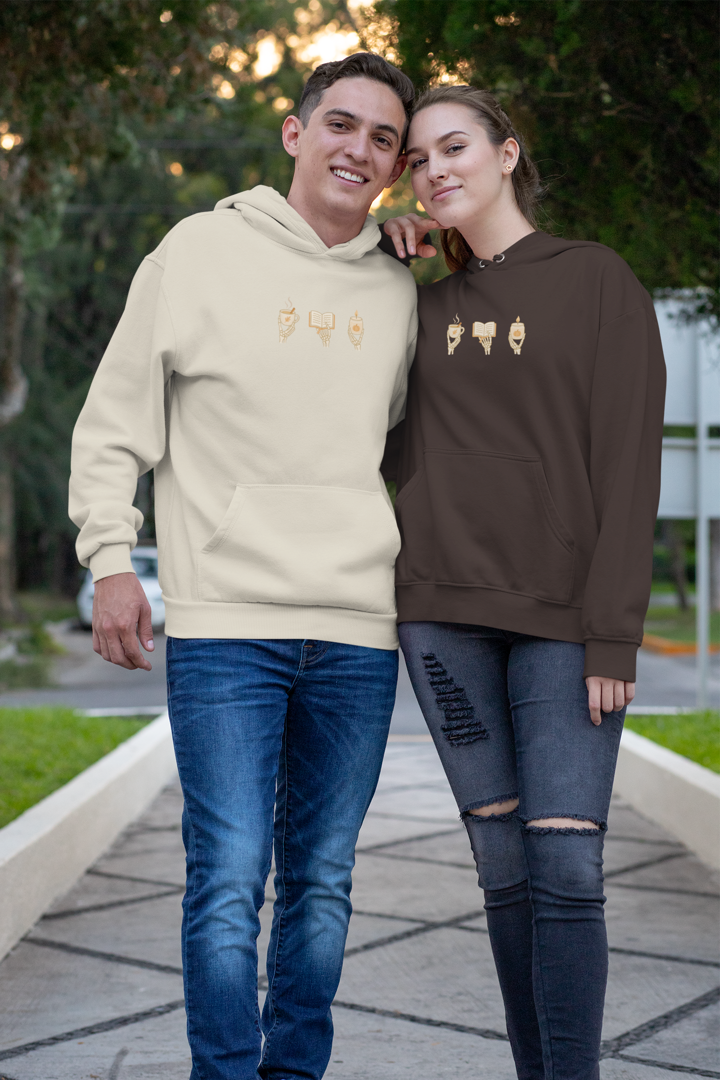 Matching adult hoodies in brown & sand with 'Cozy Bones' graphic print. Fall & halloween themed graphic sweatshirts. 