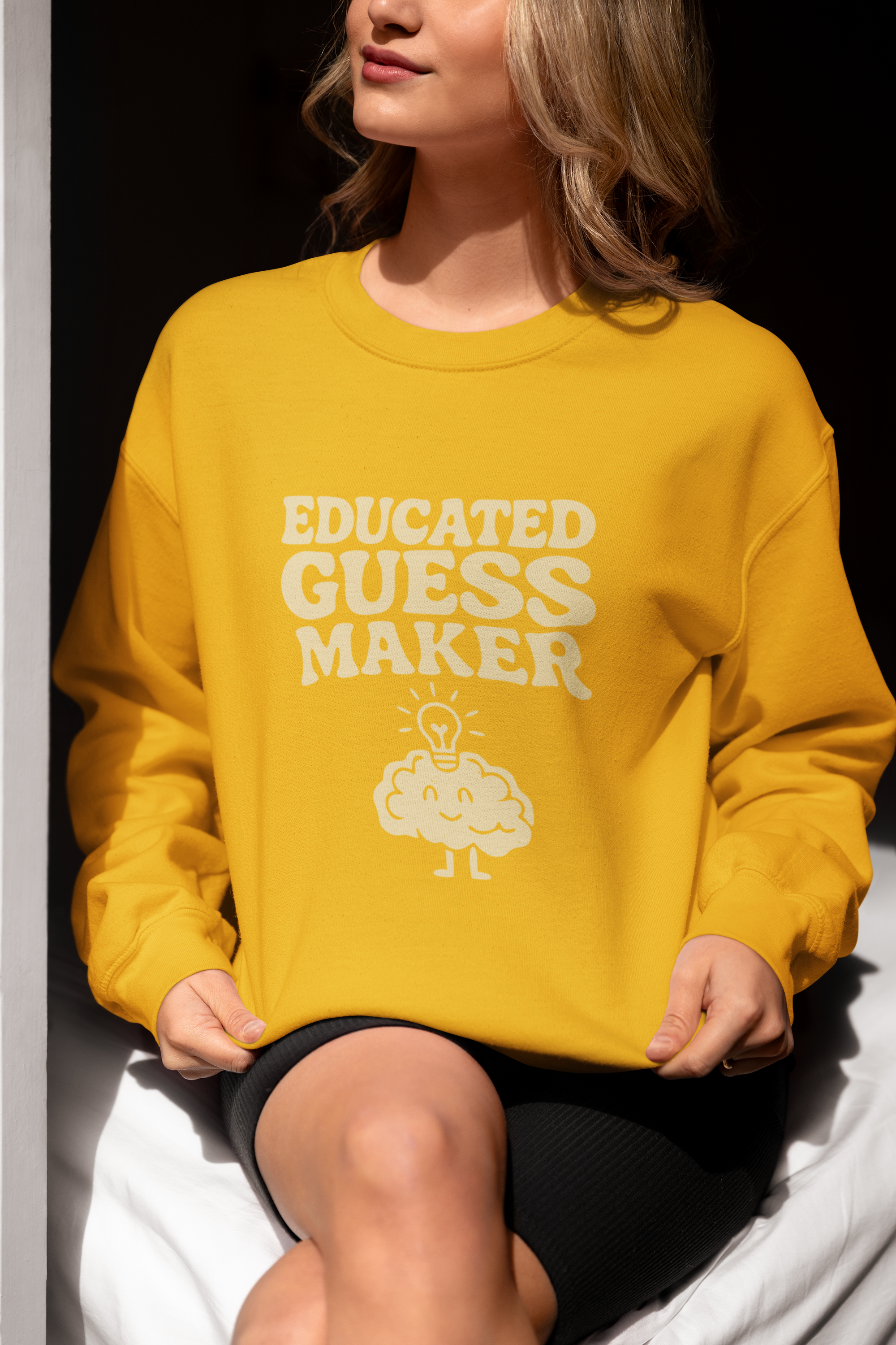 Adult sweatshirt in gold with 'Educated Guess Maker' graphic print with brain & text.  Funny Teacher & education themed graphic tees for homeschoolers.