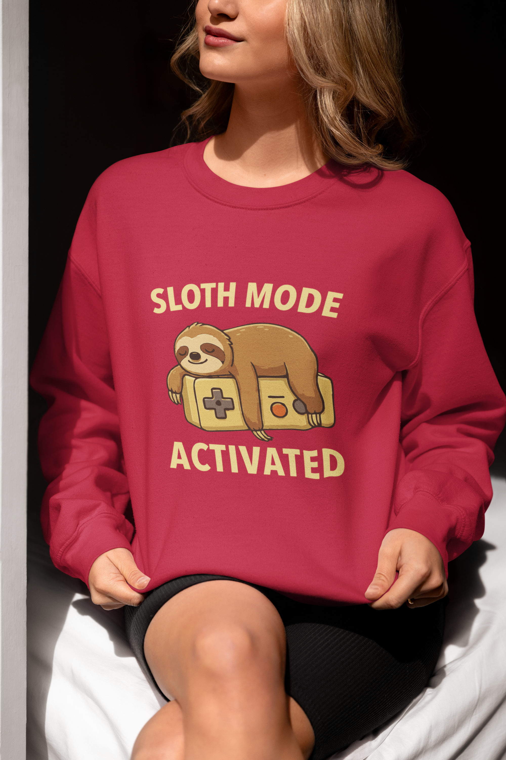Adult sweatshirt in red with 'Sloth Mode Activated' with illustrated sloth & text. Funny graphic tees and hoodies.